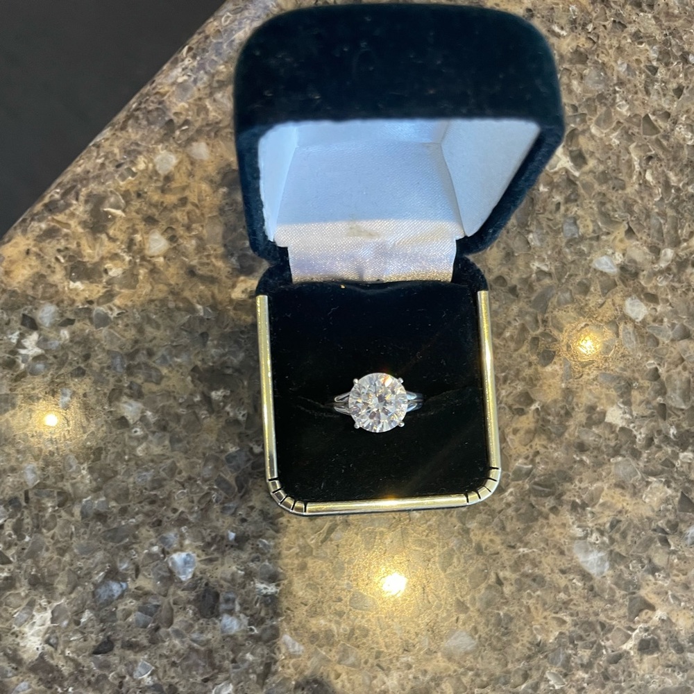 3k Diamonique solitaire.  Beautiful statement piece.